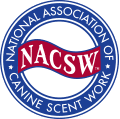 A blue and red logo for the national association of canine scent work.